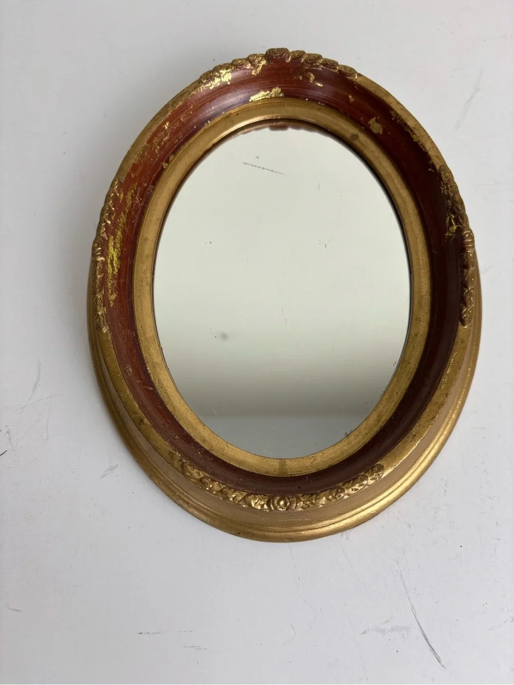 Small vintage oval wall mirror-gold /garnet red